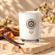 Mahonie Amber and Vanilla Blossom Candle, three-quarter view on pale natural stone.