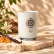 Mahonie Amber and Vanilla Candle, three-quarter view on pale natural stone.