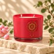 Mahonie Bubblegum Candle, three-quarter view on pale natural stone.