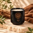 Mahonie Céramique : Musk & Leather Candle, three-quarter view on pale natural stone.