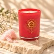 Mahonie Cotton Candy Candle, three-quarter view on pale natural stone.