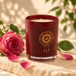 Mahonie Damask Rose Candle, three-quarter view on pale natural stone.