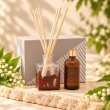 Mahonie L'étoile Reed Diffuser Set - Lilly of the Valley, three-quarter view on pale natural stone.