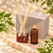 Mahonie L'étoile Reed Diffuser Set - Lilly of the Valley, elevated view on pale natural stone.