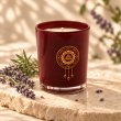Mahonie Lavender Candle, three-quarter view on pale natural stone.