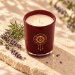 Mahonie Lavender Candle, elevated view on pale natural stone.