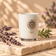 Mahonie Lavender Candle, three-quarter view on pale natural stone.