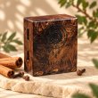 Mahonie Mahonie Exotic Wood Car Freshener - Cinnamon & Clove, three-quarter view on pale natural stone.