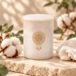 Mahonie Marbella : Egyptian Cotton Candle, ivory vessel, on pale natural stone.