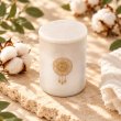 Mahonie Marbella : Egyptian Cotton Candle, elevated view on pale natural stone.