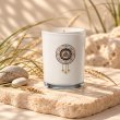 Mahonie Saltwater Sea Musk Candle, three-quarter view on pale natural stone.