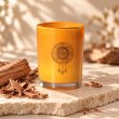 Mahonie Sandalwood Candle, three-quarter view on pale natural stone.