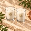 Mahonie Shot Glass Pair : Gilli Mitti Candle, elevated view on pale natural stone.