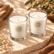 Mahonie Shot Glass Pair : Musk & Leather Candle, elevated view on pale natural stone.