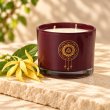 Mahonie Ylang-Ylang Candle, three-quarter view on pale natural stone.